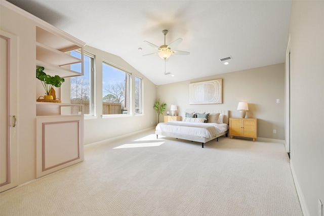 carpeted bedroom featuring visible vents, baseboards, lofted ceiling, and a ceiling fan