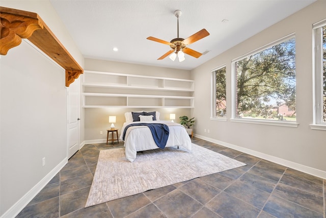 bedroom featuring recessed lighting, stone finish flooring, baseboards, and ceiling fan
