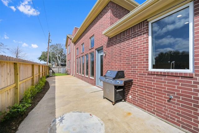 view of patio / terrace with fence and grilling area