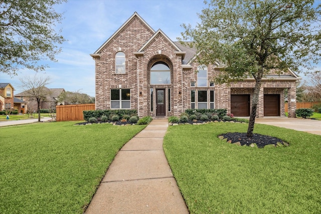 view of front of home with concrete driveway, brick siding, fence, and a front lawn