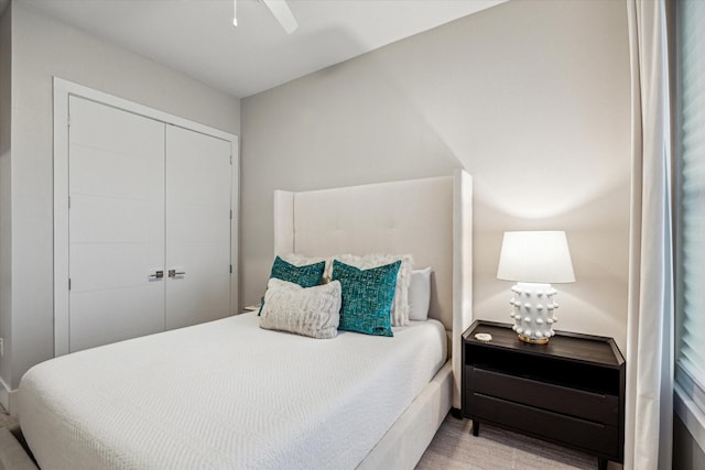 bedroom with ceiling fan and a closet