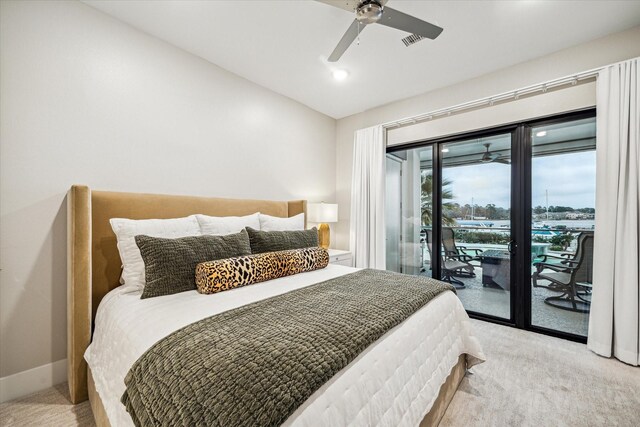 bedroom featuring access to exterior, light colored carpet, visible vents, and baseboards