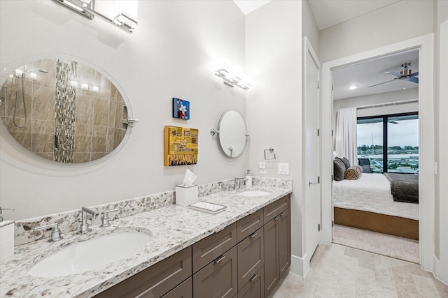 full bathroom with a sink, double vanity, ensuite bath, and a tile shower