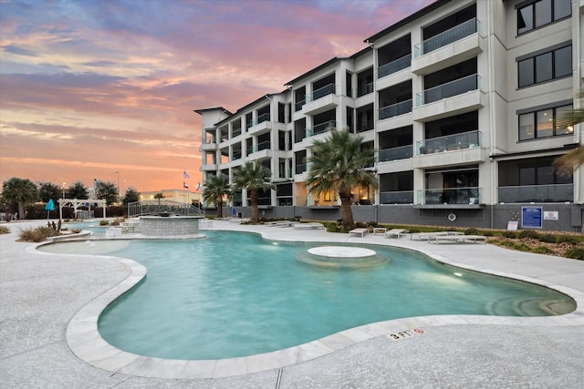 community pool with a patio area