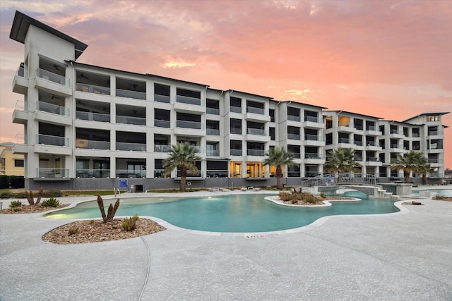 community pool featuring a patio area and a jacuzzi