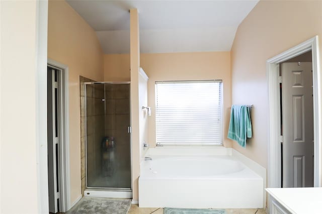 bathroom with a garden tub and a shower stall