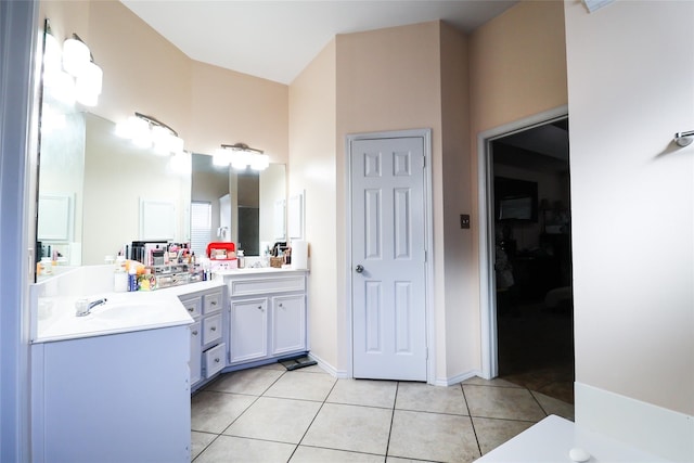 full bath with tile patterned flooring, baseboards, a closet, and vanity