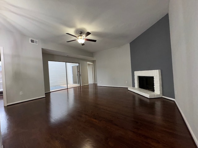 9809 Richmond Ave Unit J1, Houston, TX 77042 - unfurnished living room with ceiling fan, a fireplace, and dark wood-type flooring