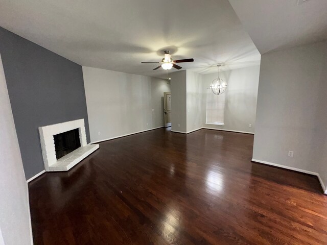 9809 Richmond Ave Unit J1, Houston, TX 77042 - unfurnished living room with a ceiling fan, a fireplace, wood finished floors, and a chandelier