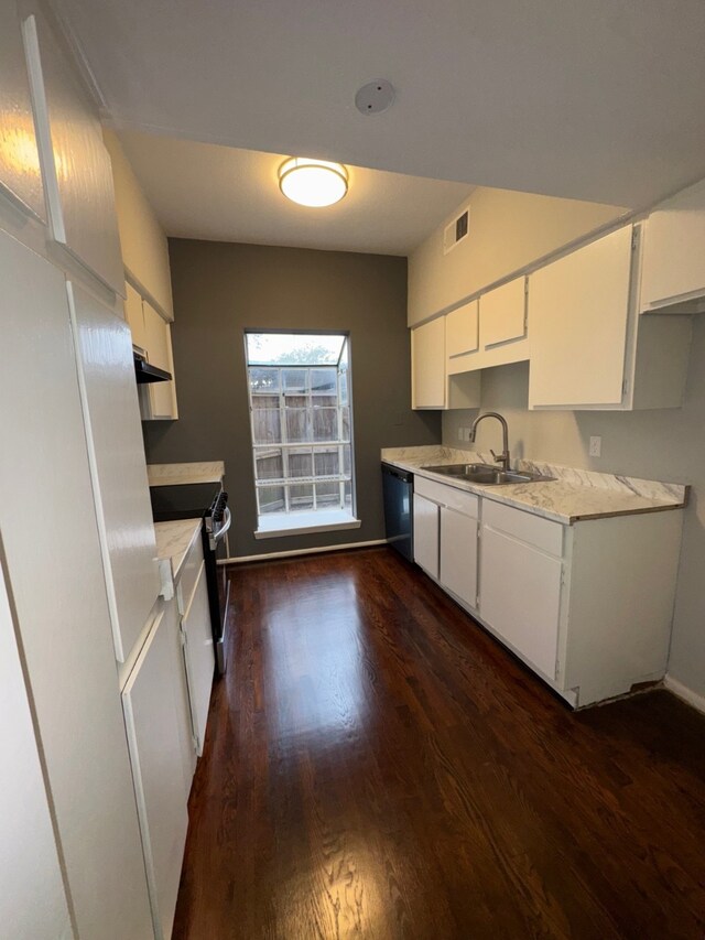9809 Richmond Ave Unit J1, Houston, TX 77042 - kitchen featuring dishwasher, dark wood-style flooring, light countertops, and white cabinetry