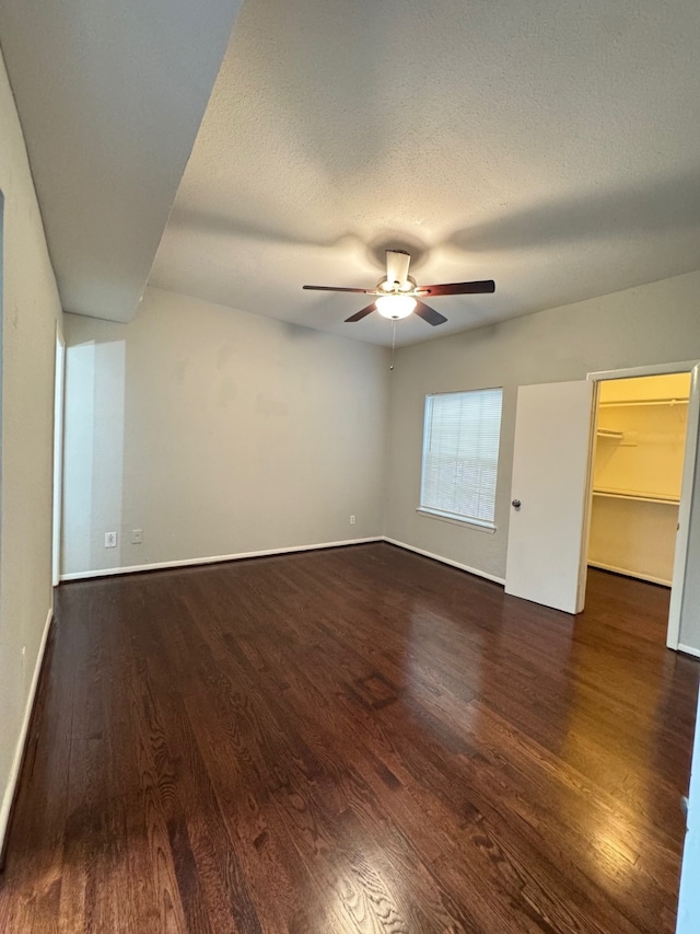 9809 Richmond Ave Unit J1, Houston, TX 77042 - unfurnished room with wood finished floors, a ceiling fan, and a textured ceiling