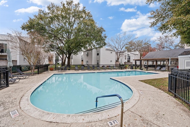 9809 Richmond Ave Unit J1, Houston, TX 77042 - community pool featuring a residential view and a patio area