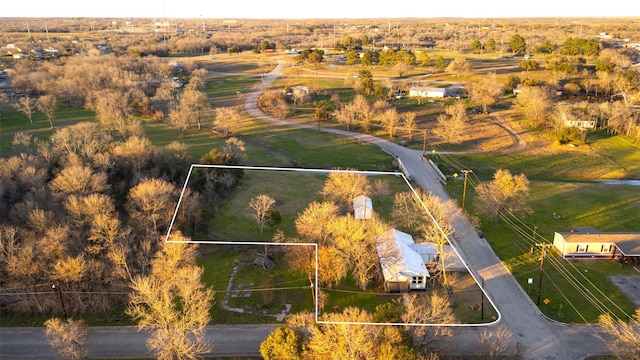 birds eye view of property featuring a rural view