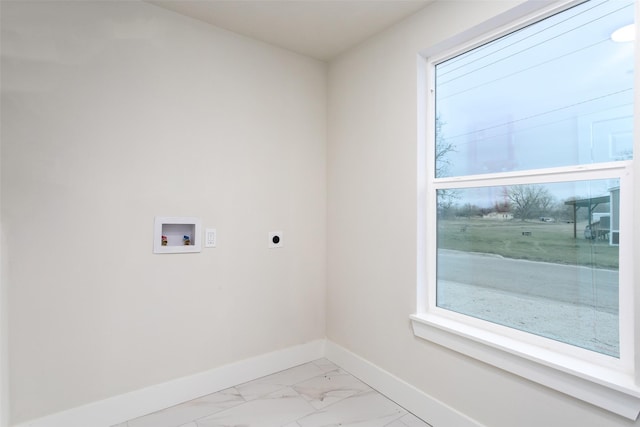 clothes washing area with washer hookup, marble finish floor, electric dryer hookup, laundry area, and baseboards