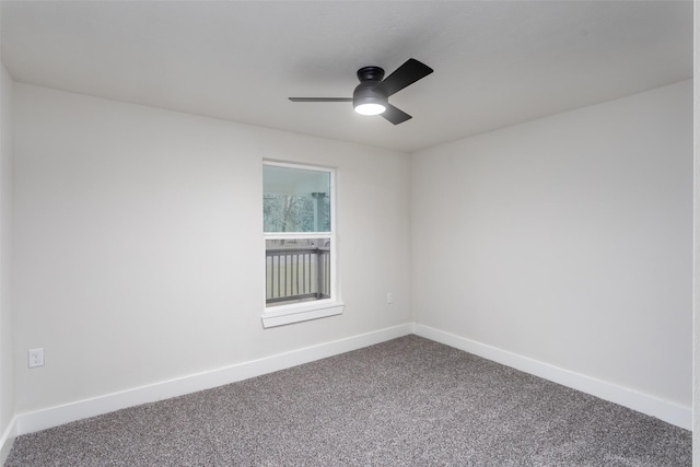 spare room featuring carpet floors, baseboards, and a ceiling fan