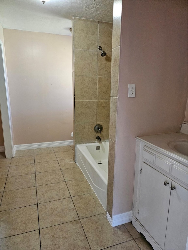 full bath with shower / bathing tub combination, toilet, vanity, tile patterned flooring, and baseboards