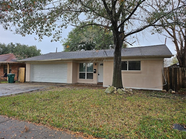 ranch-style house featuring an attached garage, driveway, a front lawn, and stucco siding