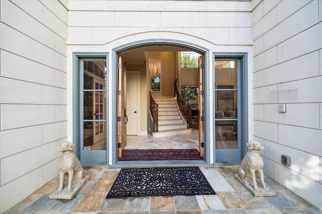 doorway to property featuring concrete block siding