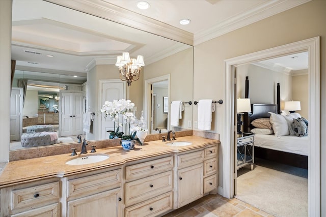 ensuite bathroom with ornamental molding, connected bathroom, a sink, and double vanity