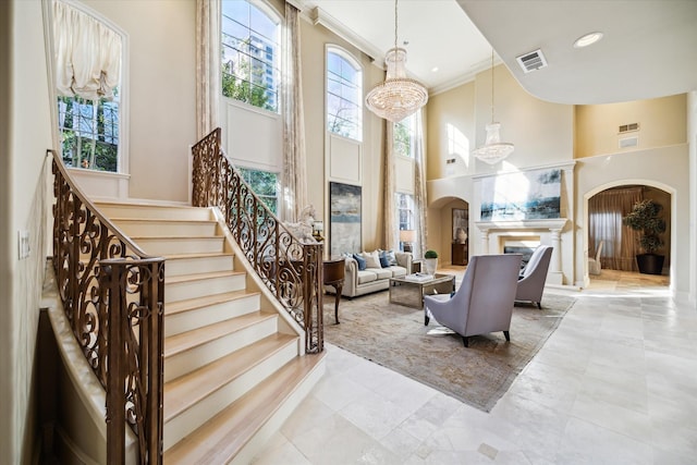 building lobby featuring stairway and visible vents