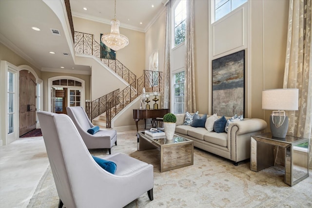 interior space with visible vents, stairway, a high ceiling, crown molding, and recessed lighting