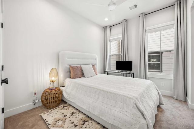 bedroom featuring light carpet, recessed lighting, visible vents, and baseboards