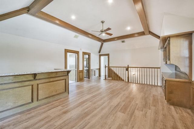 unfurnished room featuring vaulted ceiling with beams, ceiling fan, and light wood finished floors