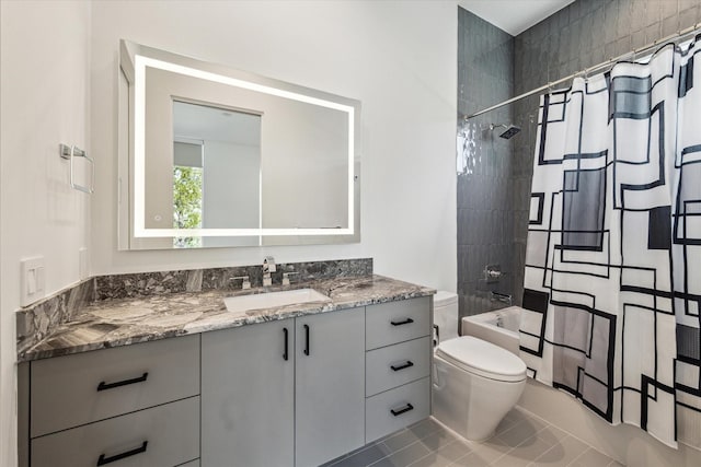 full bathroom featuring tile patterned flooring, shower / tub combo with curtain, vanity, and toilet