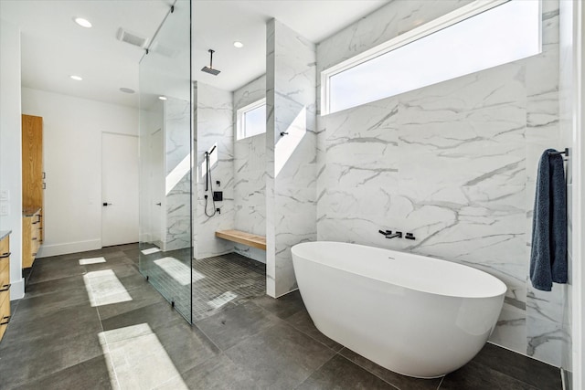 full bathroom featuring a freestanding tub, a marble finish shower, visible vents, and recessed lighting