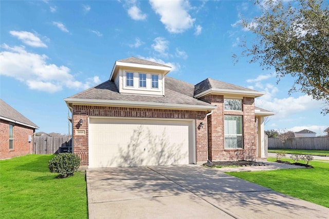 view of front of property featuring a garage, brick siding, a front lawn, and fence