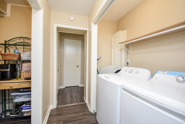 washroom featuring baseboards, laundry area, washer and clothes dryer, and dark wood-style flooring