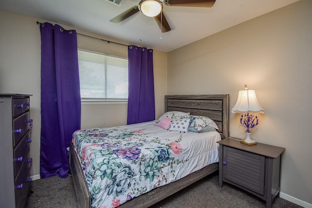 bedroom with ceiling fan, carpet flooring, and baseboards