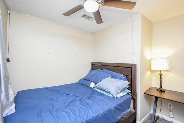 bedroom with a ceiling fan, visible vents, and baseboards