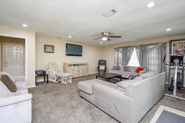 carpeted living room featuring baseboards, visible vents, a ceiling fan, a textured ceiling, and recessed lighting