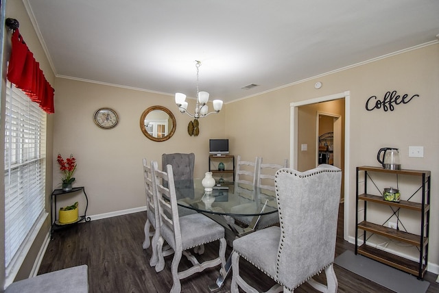 dining room with baseboards, visible vents, ornamental molding, dark wood-style flooring, and a chandelier