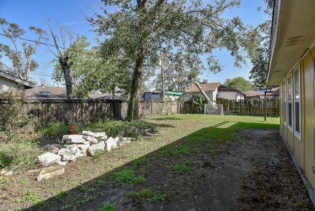 view of yard featuring a fenced backyard