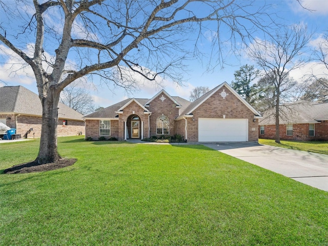 traditional-style home with concrete driveway, a front lawn, an attached garage, and brick siding