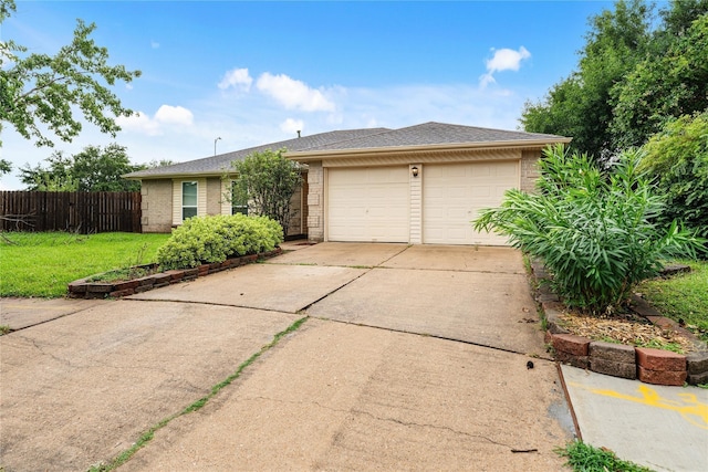 ranch-style house featuring an attached garage, brick siding, fence, driveway, and a front lawn