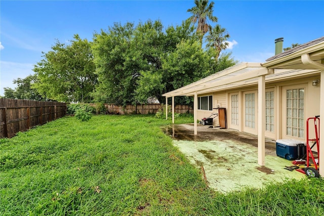 view of yard featuring a patio and a fenced backyard