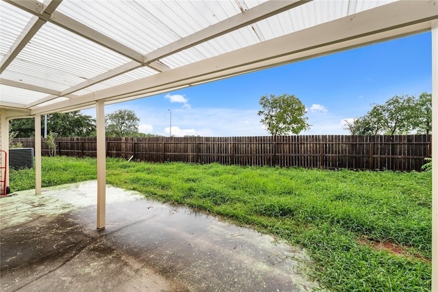 view of yard with a fenced backyard, a pergola, and a patio