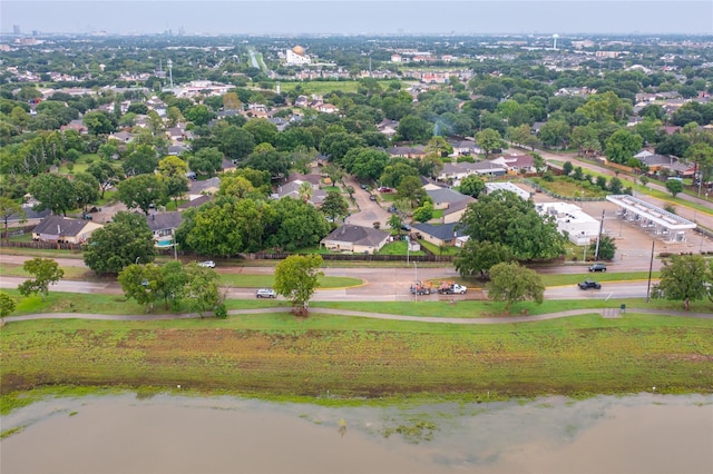 birds eye view of property with a water view and a residential view