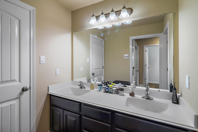 full bathroom featuring double vanity and a sink