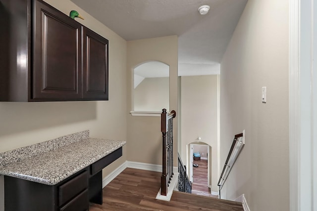 interior space featuring wood finished floors and baseboards