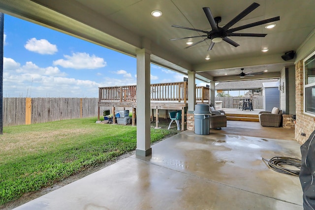 view of patio / terrace featuring a fenced backyard, ceiling fan, and a wooden deck