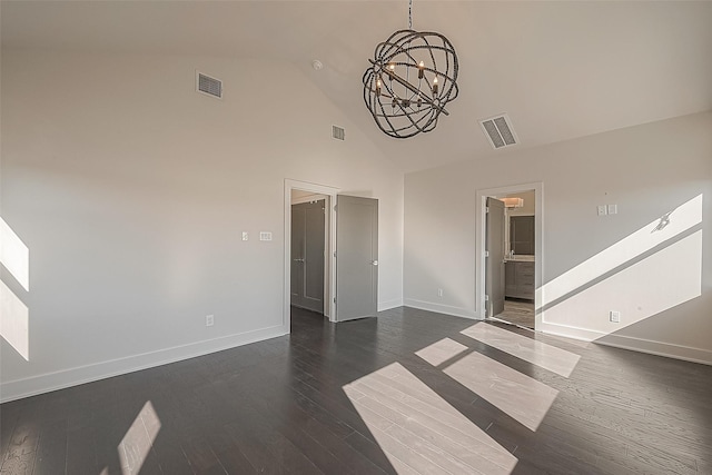 unfurnished living room with a chandelier, baseboards, high vaulted ceiling, and dark wood-style flooring