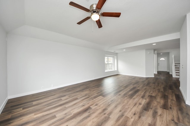 unfurnished room with stairs, dark wood-style flooring, and baseboards