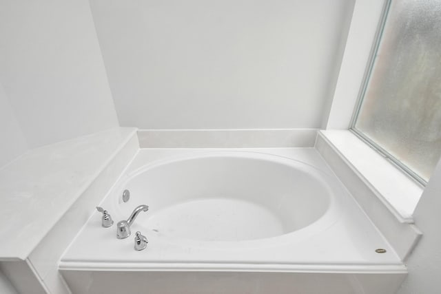 bathroom featuring a garden tub