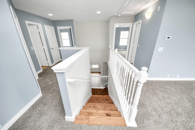 stairway featuring carpet, recessed lighting, visible vents, attic access, and baseboards