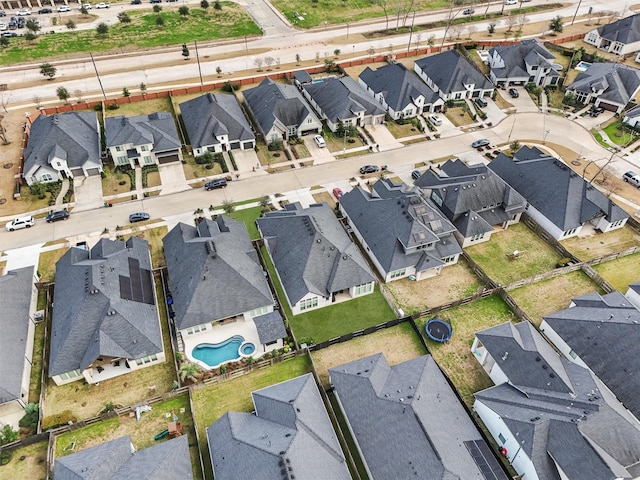 birds eye view of property with a residential view