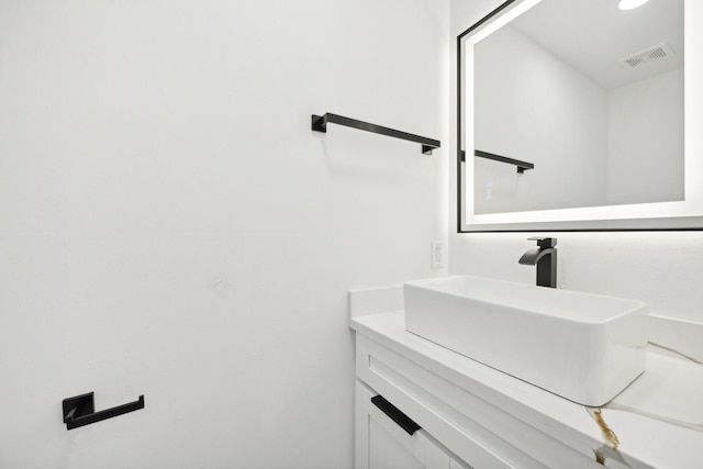 bathroom with vanity and visible vents